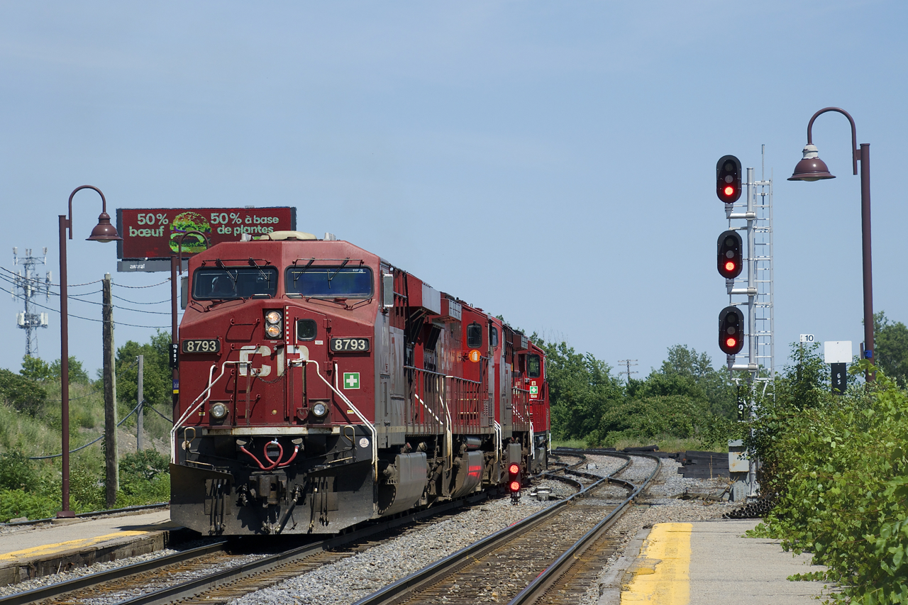 After having advanced towards Lachine Sation, CP 112's power is backing up towards Lachine IMS Yard where it will tie on to its non-intermodal cars and continue on to St-Luc Yard.