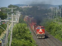 One of the GE's powering CP 119 lets out smoke as it heads west. 