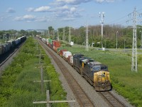 AC4400CW's CSXT 213 and CSXT 114 lead CN 327 as they approach MP 14 of CN's Kingston Sub, with the leader still in YN2 paint and the trailing unit repainted. At left is CP 119.