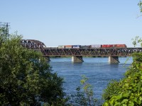 CP 8852 & CP 9708 lead CP 253 towards dry land as the train approaches the island of Montreal.