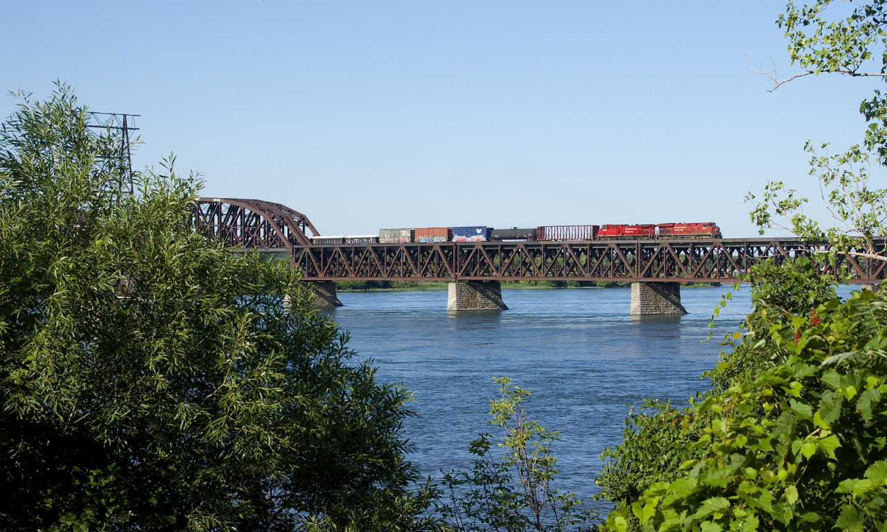 CP 8852 & CP 9708 lead CP 253 towards dry land as the train approaches the island of Montreal.