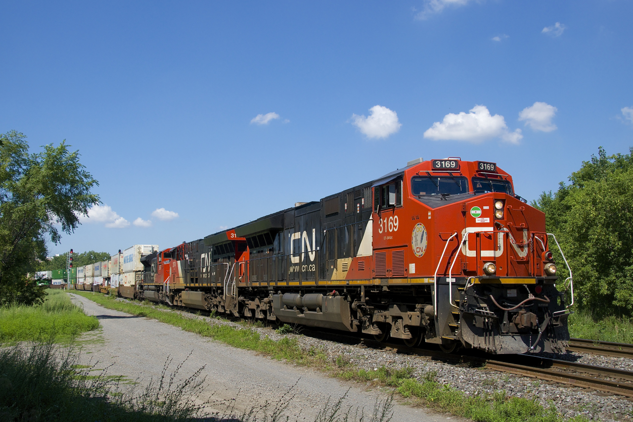 CN 120 has CN 3169, CN 3174 & CN 8867 for power and a 634-axle long train as it heads east through St-Henri. Recently this train has often not had a DPU and today's version was no exception, with all power up front.