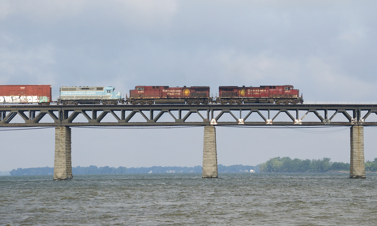CP 251 has CP 8617, CP 9752 & CMQ 3817 for power as it approaches Montreal with a long train. This is reported to be the last of the three CMQ-painted GP38-2's to leave CMQ lines.