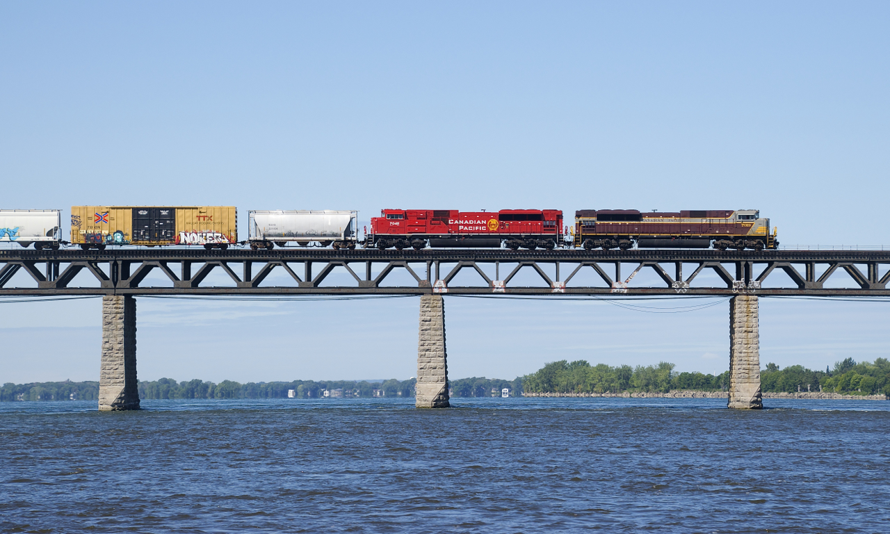 CP 253 has SD70ACU's CP 7019 & CP 7045 as it approaches the island of Montreal.