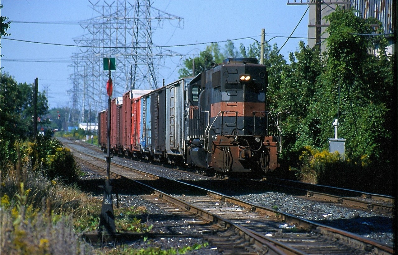 While the SD40 was a big hit for CP, the GP40 cousin was of no interest to the railroad. By the end of the 1990's CP found itself very power short for both 4 axle and 6 axle units. Mainly thanks to retiring all Alco's on its roster along with an upsurge in traffic. Helm leasing would would supply CP with both four and six axle units, and in the end CP would purchase a number of the former Guilford GP40's on lease. Prior to repainting 4656 is seen working the few existing customers left on the short Canpa subdivision as it is seen about to duck under the Queensway in Etobicoke.