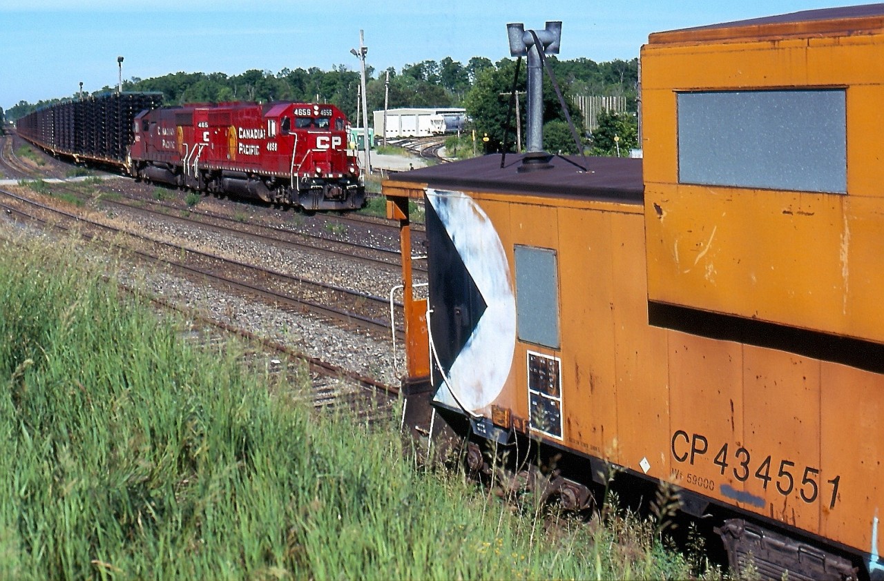 While the empty frame train 141 was never much to get excited about, the loaded eastbound 142 was totally different. After the control cab sets were retired just about any four axle power could be found the trains, including sets of GP9U'S, GP38's and the former Guilford GP40'S. This day found a matching set of repainted Former Guilford/ B&M in charge as the headed for the large GM plant in Oshawa. The old CP van was in a good spot this day to add to the image. It's sad that this train and all automotive assembly work in Oshawa is now history just like the Ford plant that once sat in Talbotville not far from where these frames originated in St. Thomas. Sadly the auto industry in Ontario is a far cry from what it once was.