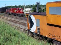 While the empty frame train 141 was never much to get excited about, the loaded eastbound 142 was totally different. After the control cab sets were retired just about any four axle power could be found the trains, including sets of GP9U'S, GP38's and the former Guilford GP40'S. This day found a matching set of repainted Former Guilford/ B&M in charge as the headed for the large GM plant in Oshawa. The old CP van was in a good spot this day to add to the image. It's sad that this train and all automotive assembly work in Oshawa is now history just like the Ford plant that once sat in Talbotville not far from where these frames originated in St. Thomas. Sadly the auto industry in Ontario is a far cry from what it once was.