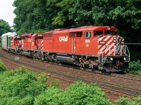 It still boggles my mind that this shot was taken 18 years ago, wow how time flies! Apparently my birthday that year wasn't too busy as I had time to head to Campbellville with a good Railfan friend for a good part of the day. Knowing we had a pair of eastbounds on the way but a good distance away we decided to hike in and look for a new location to shoot, a spot somehow I have never returned to. Eventually the two trains arrived with the second one having a decent consist. Anytime a red barn was in the lead, to me it became a decent lash up, LOL. I believe 9019 was the only red barn CP bothered to fill in the set of class lights on.  