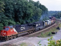 Looking back Fifteen years ago, when just about anything could be found plying CN's rails and EMD products still outnumbered those of GE. This day I caught a CN "all in the family" lash up working it's way west through Bayview jct. Following the Dash9 is rebuilt IC SD40 as well as a former rebuilt CN SD40, originally rebuilt for KCS but later returned and picked up by CN and sublettered for the GTW. Trailing is one of Wisconsin Central's many SD45's at the time. Those were the good old days for me :)
