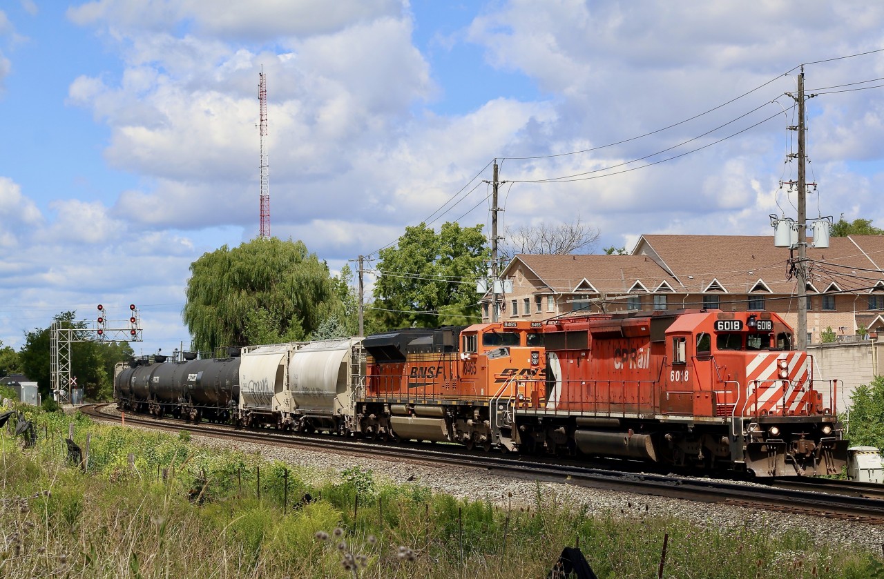 It was feeling almost like old times or at least maybe a decade ago as CP 244 rolled through Streetsville this afternoon. It's always nice to catch an all EMD lash up these days, but even better when it is led by a SD40-2 in full multi mark paint, something one definitely doesn't see much anymore. I've also always liked how the BNSF paint looks on the SD70ACE's as well.