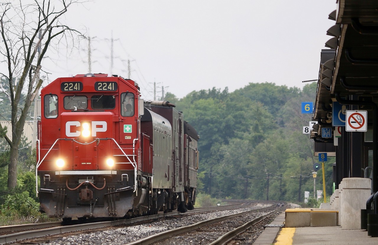 The lifeless GO platform at Meadowvale tells the tale of what Covid has done to Toronto bound ridership, as I look at two almost empty parking lots on either side of the tracks. I don't spend much time at the station here mainly due to the lack of decent lighting most of the day with the platform only on the north side. What is nice is how with the proper lense a city scene almost appears to be in the country thanks to the track side forested areas west of the station. This day a rare morning northbound off the Hamilton subdivision brought me to the station despite the overcast and stormy weather. Soon GP20 ECO 2241 appeared with the short TEC train. It's nice to see the old search light signals still active here.