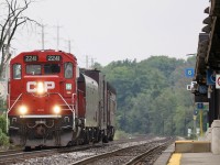 The lifeless GO platform at Meadowvale tells the tale of what Covid has done to Toronto bound ridership, as I look at two almost empty parking lots on either side of the tracks. I don't spend much time at the station here mainly due to the lack of decent lighting most of the day with the platform only on the north side. What is nice is how with the proper lense a city scene almost appears to be in the country thanks to the track side forested areas west of the station. This day a rare morning northbound off the Hamilton subdivision brought me to the station despite the overcast and stormy weather. Soon GP20 ECO 2241 appeared with the short TEC train. It's nice to see the old search light signals still active here. 