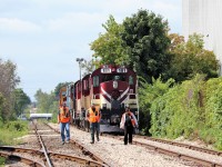 After making their final journey from Guelph Junction to Guelph, The crew of OSR 181 take the last walk from their train to a waiting ride at Dawson Road. The five engine consist of OSR 181, OSR 505, OSR 180, OSR 506 and OSR 504 with five cars and 2 Vans OSRX 434462 and OSRX 4900 taking up the rear, drew quite the crowd as they slowly worked their way to this new siding to await pickup by CN.