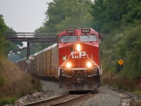 147 rounds the bend at Mile 55 with a clean rebuild and a BNSF unit trailing.