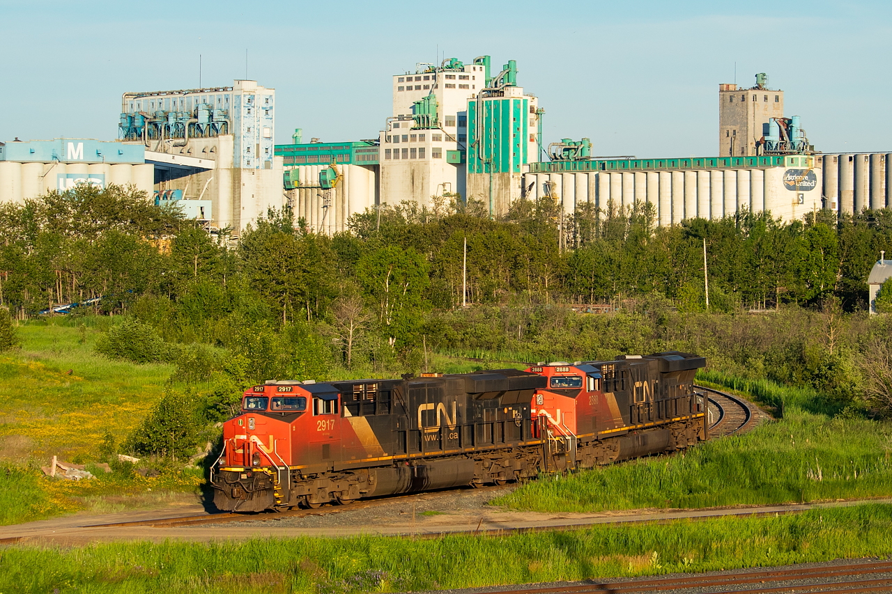 This power had come into Thunder Bay earlier in the morning on G862 (grain loads from Winnipeg) and is resting in front of several of the now disused elevators at the city's port. For anyone who likes the details - 2917 was the head-end unit, and 2888 was the mid-train. I'd done this angle once before on my last trip to Thunder Bay - early in the morning once 436 had tied down in the same spot. Back then I didn't really pay much attention to lighting - it was more see train/shoot train.