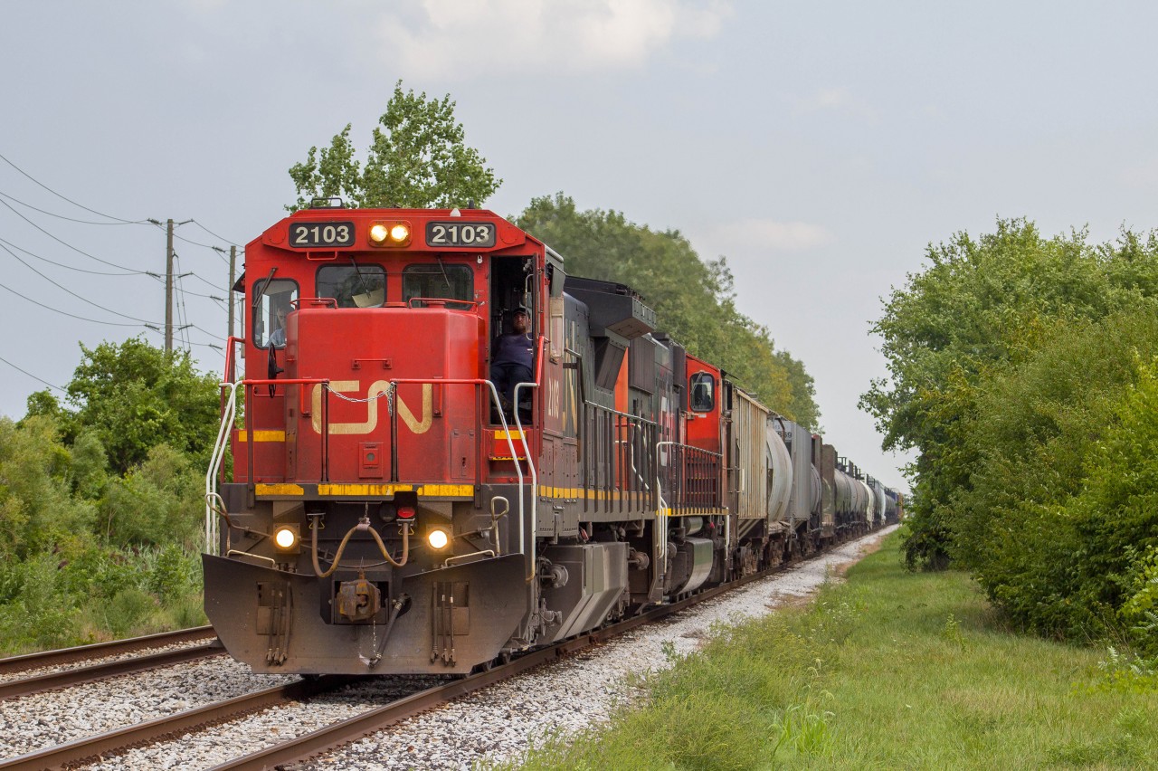 Cn 439 with a standred cab leading as it makes its way to a wye to get to Van de water