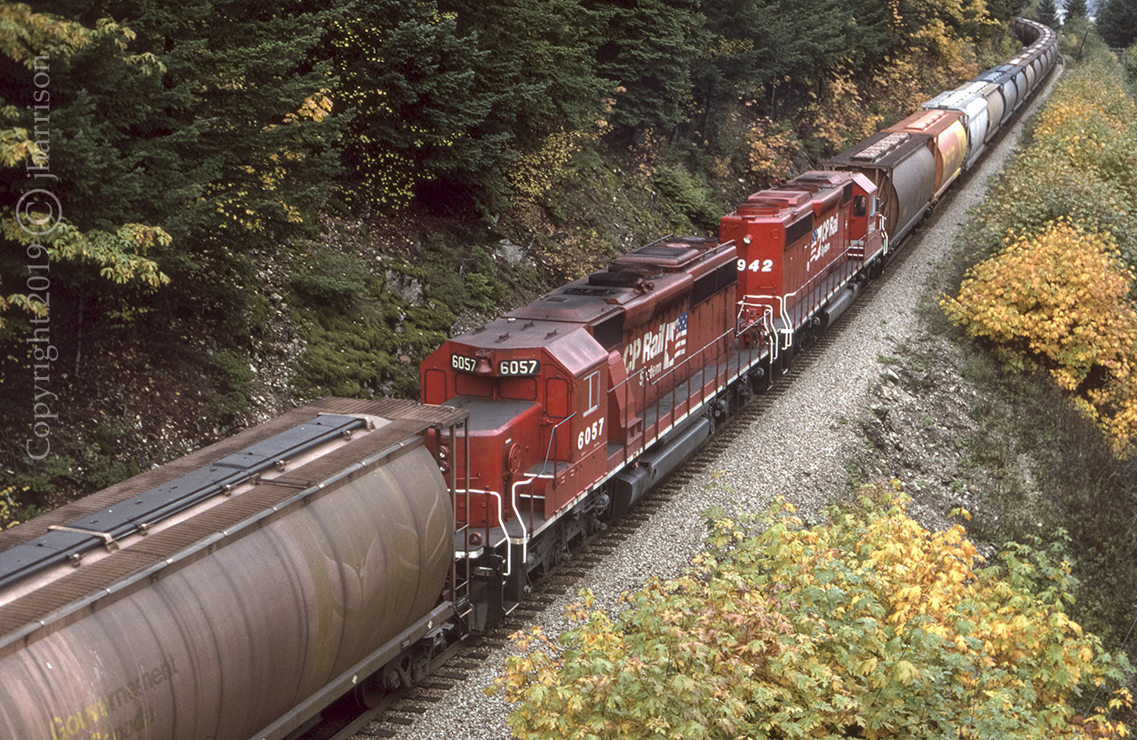 ..... and a shot of CP RCUs 6057 and 5942 that were traveling west with CP 9008 6003 5978 5171 and 5707 at China Bar on CPs Cascade Sub near Spuzzum. They're about to pass under the Alexandria Bridge which crosses over the Fraser River and both CP and CN lines at this location.