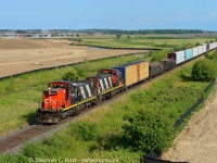 2015, take me back I said to the time machine, and it delivered. L551 back to using this pair as  they did a few years ago approaching Milton, Ontario, well, what you see will very soon be turned into housing and become part of the City. So much for green space eh? A nice afternoon run for 551 makes this easy pickings.  Almost zero percent interest rates fuel the development of nearly million dollar townhomes in Milton - behind the development in the distance at CN Ash? where the CN Milton Intermodal Terminal is supposed to go. Cue the protesters who are about to buy homes a stones throw from a truck and train paraside. Also note the Brittania Rd overpass which will soon become my next subject matter for a photo spot, I had my first cab ride there in 2002...



