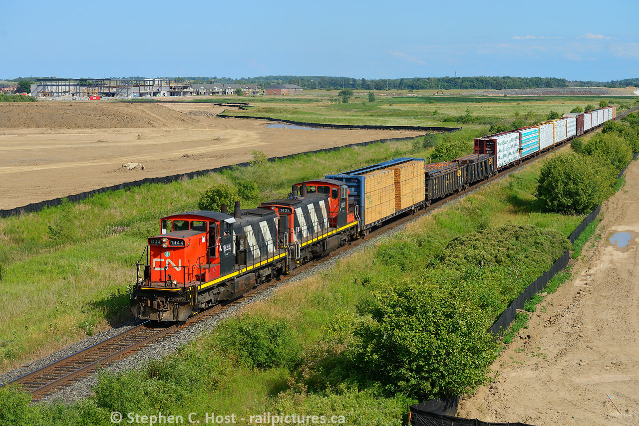 2015, take me back I said to the time machine, and it delivered. L551 back to using this pair as  they did a few years ago approaching Milton, Ontario, well, what you see will very soon be turned into housing and become part of the City. So much for green space eh? A nice afternoon run for 551 makes this easy pickings.  Almost zero percent interest rates fuel the development of nearly million dollar townhomes in Milton - behind the development in the distance at CN Ash? where the CN Milton Intermodal Terminal is supposed to go. Cue the protesters who are about to buy homes a stones throw from a truck and train paraside. Also note the Brittania Rd overpass which will soon become my next subject matter for a photo spot, I had my first cab ride there in 2002...