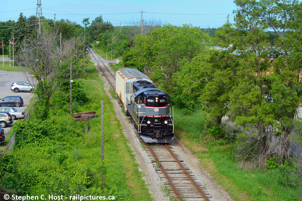 While on a 2 week vacation, I took the time to finally cross the Barrie Collingwood Railway off my list. Here's a heavy train coming from Utopia off the Meaford sub about to cross under the 401 in Barrie. Branchline railroading at its best.