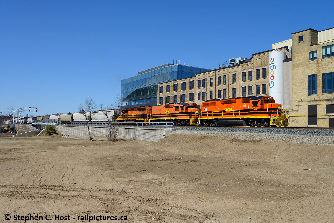 Brains meet brawn - The brawn of GEXR's few thousand horsepower pass by the brains at Google who are harvesting our data on a daily basis to serve us ads. I made sure to capture this angle, as where I'm standing, the now empty lot which used to host a Beer Store and Korean Grocery soon become the Transit Hub for Waterloo - both a heavy rail and LRT station. For some reason, KW is hot to trot to build a highrise with mixed use as part of it, But the project has been stillborn and is going to new contractors and up for design - again. Too bad the Kitchener VIA station is not part of the Region's plans for a transportation hub, I guess it's not high rise enough. That's right, get your shots, the VIA station most certainly won't be used for trains once this lot is filled in. Construction has yet to begin as of 2020.
Earlier in the day I was out in the country with Jason Noe and we captured this then chased the train east. Fun day!