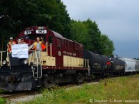 People part three.  People. The people that make the railway move the people we photograph. While we stop taking photos they are still out there making the cut, walking the train, setting brakes, sometimes in weather that make us complain and go home. They don't go home until the job's done.The last train to operate on the Guelph Junction Railway was the yard job, ordered 1430 daily at Guelph Junction. I met the train after they had finished switching lower yard and the crew happily obliged for the gaggle of cameras already present for the impromptu, and unplanned photo shoot (no one, not even I knew where it may happen since it was wholly unplanned). Posing for the cameras  is Paul Jarvis (CP), Karol Belawski (CP), and Andrew Nichol (CN) with Andrew waving goodbye to the cameras. Do note that as I took these photos, Job 2's recrew was still in the north end finishing their work. There are lots of people not in these photos who are part of OSR, apologies to them we'll get to them in the not too distant future, I certainly have photos of everyone. Thanks to this crew and everyone else who made our photographs possible, we know the hard work was yours, all we did was click the shutters. 