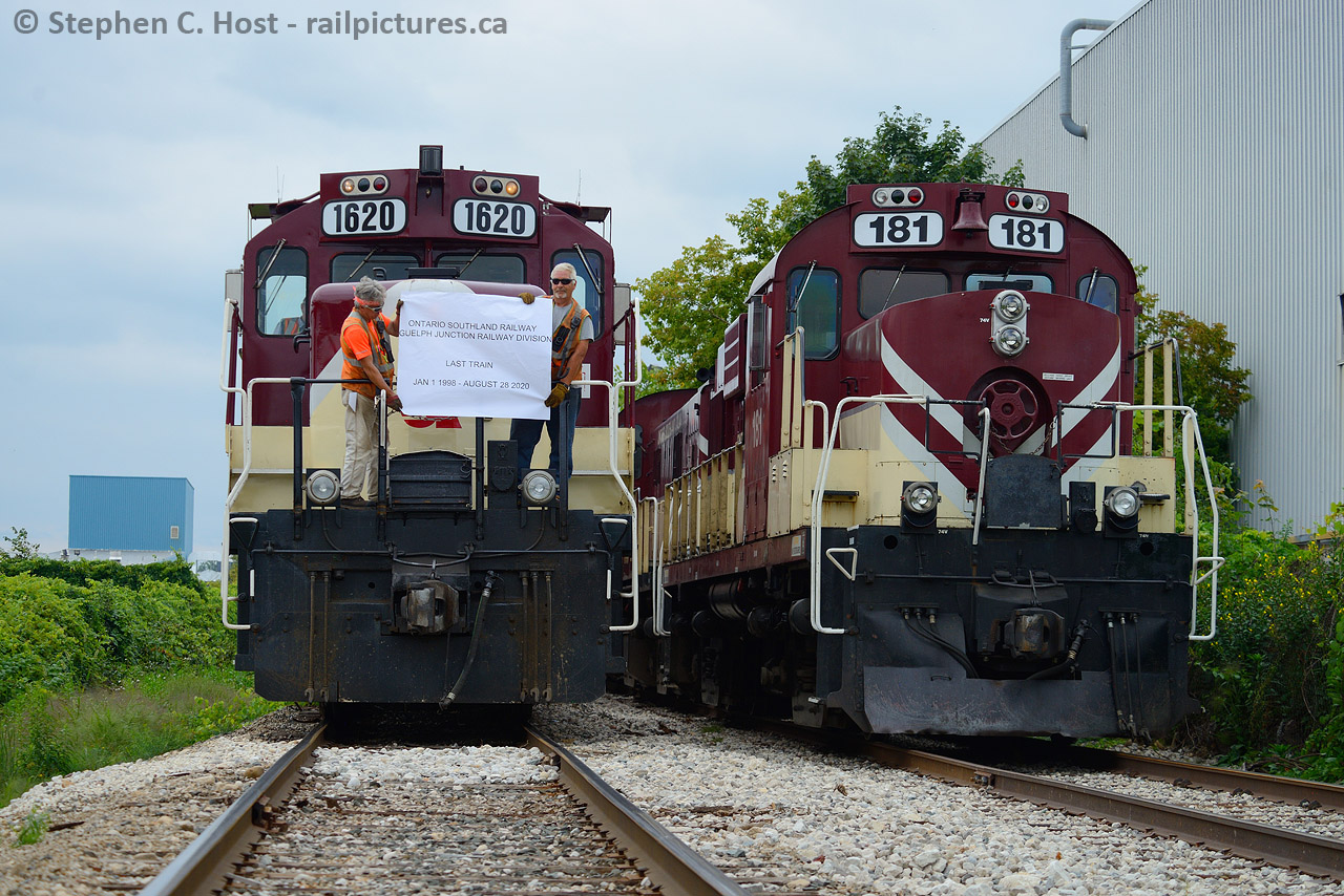 People. The people that make the railway move the people we photograph. While we stop taking photos they are still out there making the cut, walking the train, setting brakes, sometimes in weather that make us complain and go home. They don't go home until the job's done. Ontario Southland Railway had their final day in Guelph today, and while I went into work for a bit, I printed a banner at the last minute and met the trains to convince them to photograph the people who make it all happen whom the OSR crews happily obliged. This is Job 1, who work the mornings and get re-crewed by the 1400 re-crew, who taxi from the Junction in the OSR crew SUV to relieve the guys. To the right is the "RIP" train parked in the siding that Bill Purdy posted earlier. While they waited for their chariot to arrive, they had posed both trains together and I added to their decision by bringing  banner, to the delight of the gaggle of people crowded along Dawson Rd. Pictured is Jamie Rolston, and Jim Frechette, in the hoggers chair is Peter Harwick.  Mr. Rolston ran  the first OSR train on January 2 1998 and helped closed things off today. Thanks guys!