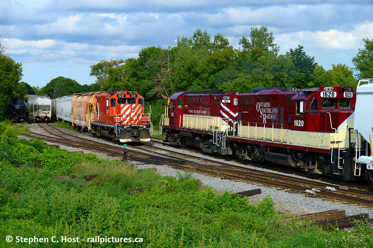 Sometime late in the summer of 2020 GJR completely cut the brush in this location making this nice wide open spot that begged for two train to meet. Getting a meet here was incredibly difficult to do, but after work on August 17 all the stars aligned including the sun. Job 1 with Tom Domladovic on the front porch  waves at Job 2 Engr. Peter Harwick in the cab of 1591 as both trains pass the north end of Lower Yard by Stevenson St in Guelph.