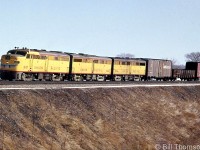 Another photo of a set of Union Pacific Alco FA1/FB1's working on Canadian Pacific, this time units 1627, 1616C and 1614B are shown leading a freight on the Galt Sub, south of Streetsville in 1964. Leased by power-short CP during 1963-1964, the old FA1 and FB1 units UP sent up were run together in sets of 2, 3 or 4 units, typically only running with other UP units during their tenure on CP. By this time the units were at the end of their lifespans, and upon return to UP they were used as trade-in units for new power.<br><br><i><u>More UP Alcos on CP:</i></u><br><br>Two sets at CP's Lambton Yard: <a href=http://www.railpictures.ca/?attachment_id=37872><b>http://www.railpictures.ca/?attachment_id=37872></b></a><br><br>Passing the station at Guelph Junction: <a href=http://www.railpictures.ca/?attachment_id=16939><b>http://www.railpictures.ca/?attachment_id=16939</b></a>