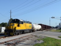 ETR 108, on the Sunday Local, heads across Kildare Ave, in Windsor, with 1 empty tank car from Hiram Walker, and 5 Center Beams, from Lumber yard off of Walker Rd. This shot has changed so much over the years, with the disappearance of few factories, the biggest one being GM Transmission plant on the right side.