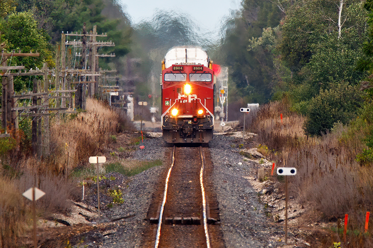 A day with less heat haze allowing this long distance shot of 147 on the hogbacks east of Cambridge.

For the "photo police", yes I am standing on the crossing, the train is 9/10's of a mile away, cars still crossed after this shot, and I was off the crossing before the wig-wags started, so I will have caused no alarm to the crew.
