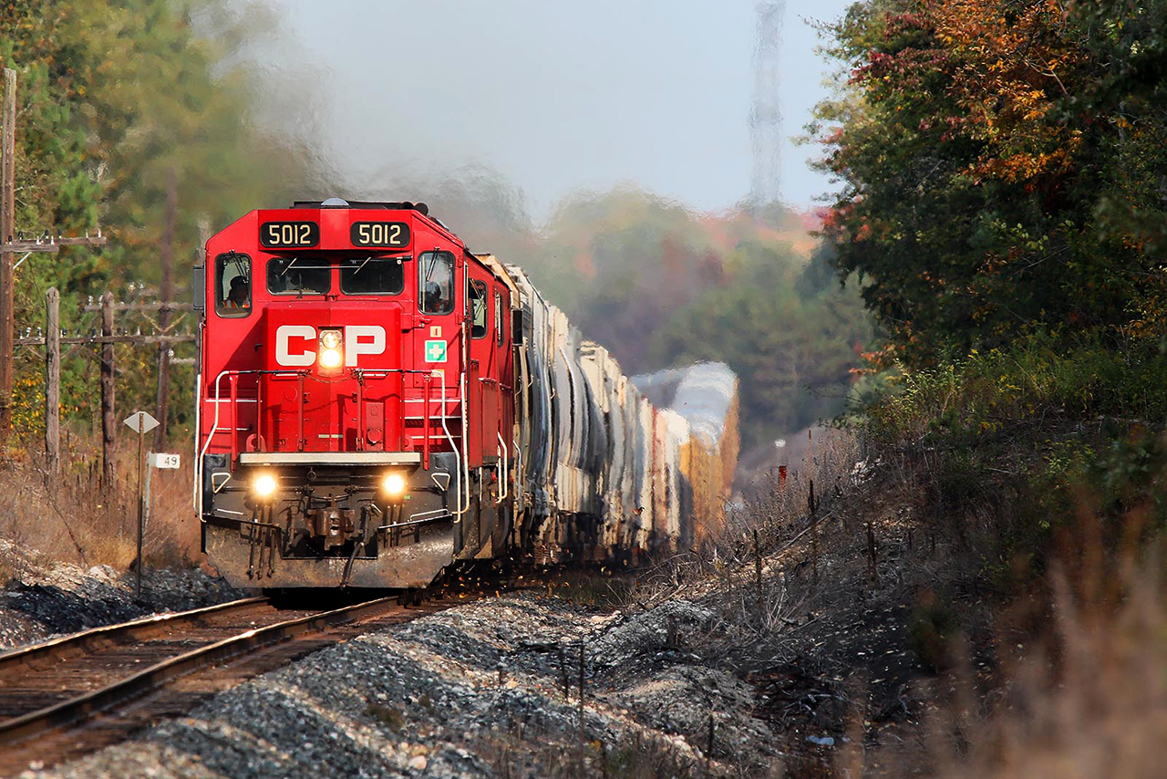 Fall colours have started to arrive, and 255 is doing a fine job of kicking up the leaves that have fallen as it rides the roller coaster east of Galt.... at track speed which is always nice to see.
