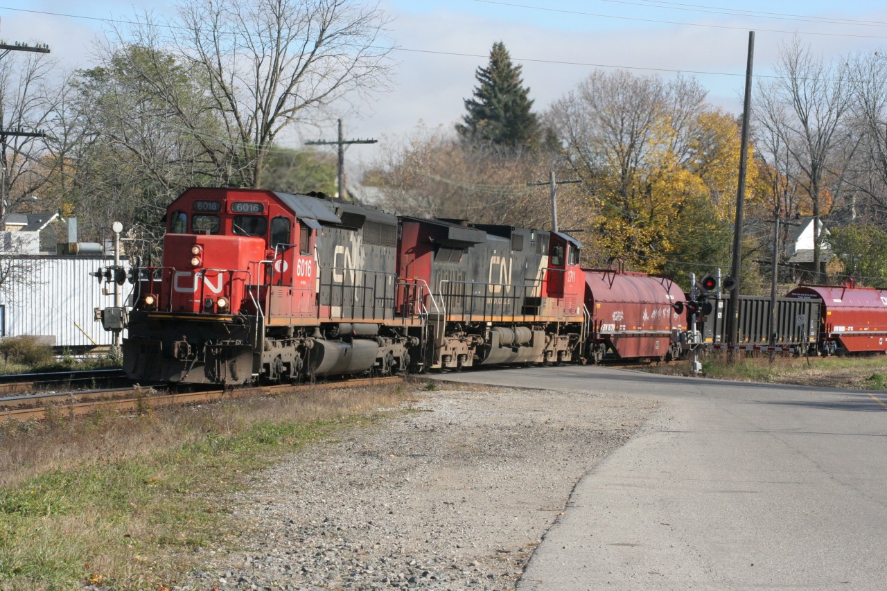 A CN westbound curves through Paris with CN SD40-2 6016 and IC 2711 on November 1, 2008.