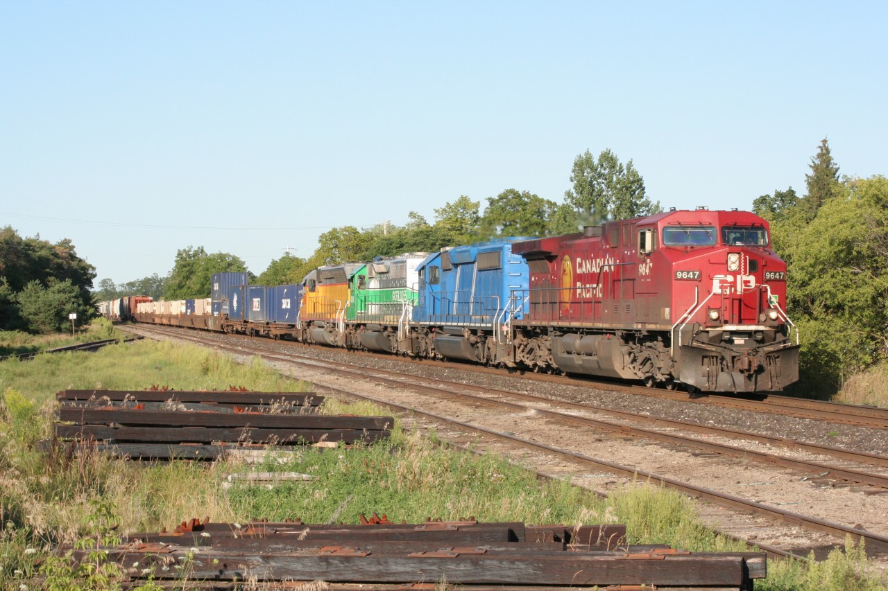 A westbound CP mixed freight rolls through Ayr with a rainbow of leasers on August 30, 2008.