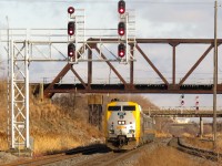 VIA 907 leads a 4-pack of LRC coaches through Oshawa right behind CN M305. VIA 907 did not stop at Oshawa VIA (maybe that could help ID the train).