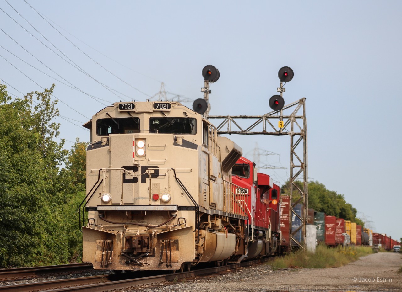 CP 7021 "Military Sand" leads 421 West on the North Toronto with 6259 a SD60M Trailing second and 9359 a boring Gevo!