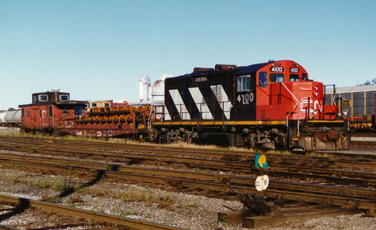 All is quiet at the east end of the CN yard in London as GP9RM 4100 and a short train are seen during an early fall morning.