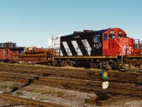 All is quiet at the east end of the CN yard in London as GP9RM 4100 and a short train are seen during an early fall morning. 