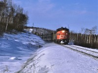 CN's train #2, the Super Continental, heads east out of Capreol Ontario on the now abandoned Alderdale Subdivision.  Power for the train is 6533-6629-4104.  The day was clear and cold and the train was only off the advertised by an hour or so.  