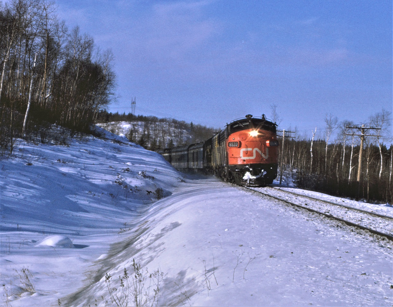 CN's train #2, the Super Continental, heads east out of Capreol Ontario on the now abandoned Alderdale Subdivision.  Power for the train is 6533-6629-4104.  The day was clear and cold and the train was only off the advertised by an hour or so.