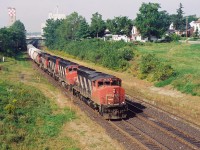 Twenty-four years ago, CN 392 makes it's way through through Woodstock on the CN Dundas Subdivision with 9526, 9576, 9448 and 9643. At the time, this train operated from Sarnia to MacMillan Yard in Toronto. 