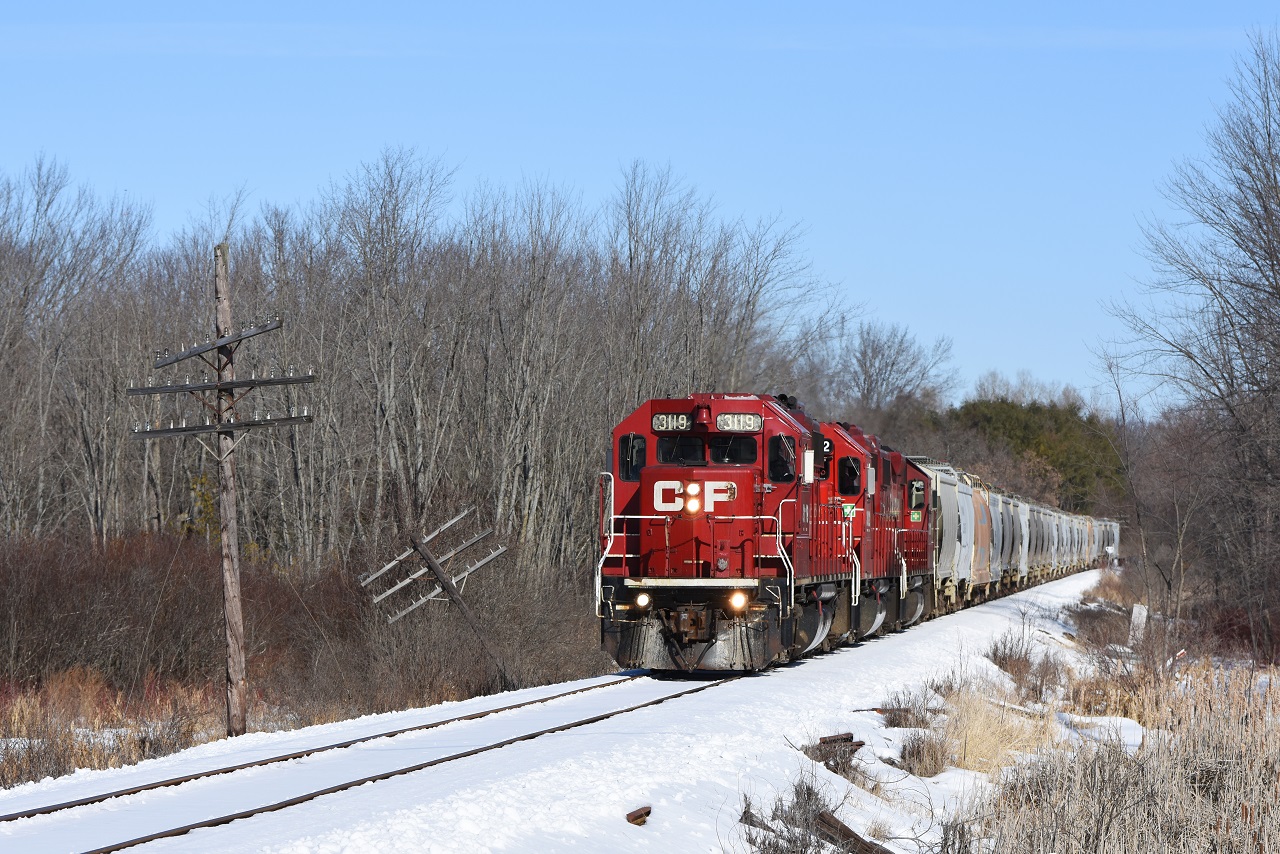 The engineer of CP's Havelock turn notches his 3 GP38's between 1 and 2 to keep the train between 10 and 15MPH as they rock along the frozen snow covered trackage of the Havelock sub. This train operates between Toronto and Havelock 3 times a week bringing loaded frac sand cars back from the mine in Nephton. On the opposite day it's Eastward counterpart brings empties up from Toronto. Usually having a GP20 somewhere in the consist I was delighted to see a trio of original EMD's hauling today's train back to the six.