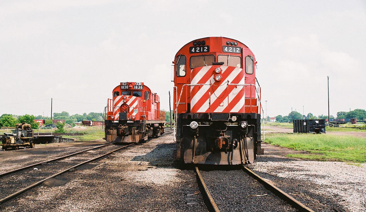 CP C424 4212 and RS18u 1836 were the assigned power for the locals based out of the Smiths Falls, Ontario yard during a hazy summer afternoon. MLW 1836 was eventually converted to CP Control Cab 1117 while 4212 was later sold to the Quebec Gatineau Railway (QGRY).