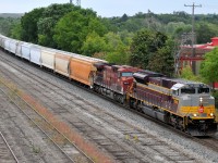 147 cruises past a rather barren looking Galt yard (what's left of it!) with CP 7018, CP 9615, and a mixture of 48 hoppers/racks