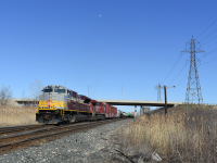 CP 235 with a gray and maroon SD70ACu in lead works the West end of Walkerville yard in Windsor.