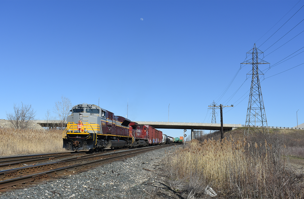 CP 235 with a gray and maroon SD70ACu in lead works the West end of Walkerville yard in Windsor.