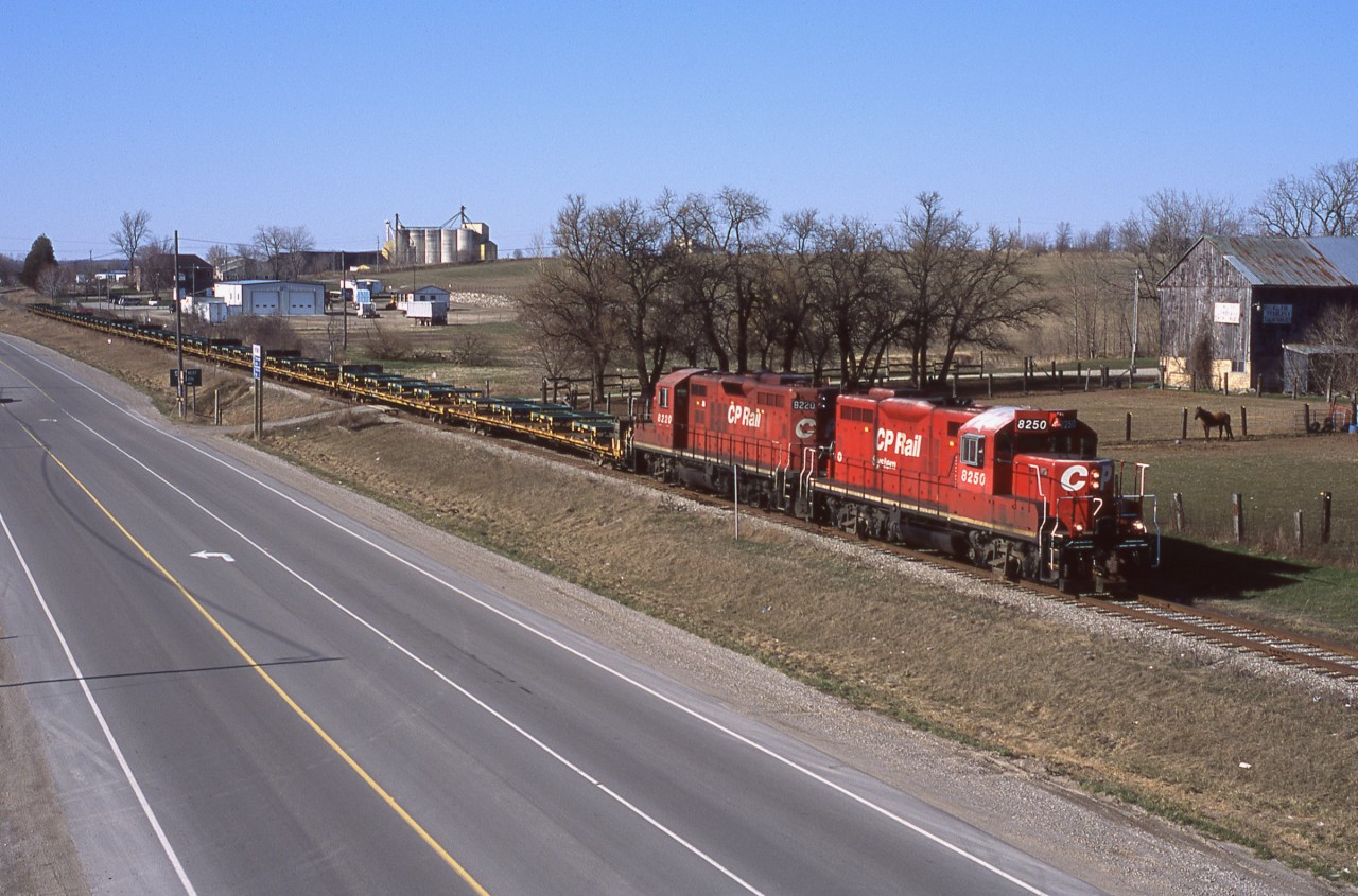 CP 141 makes it's normal afternoon trip down the St Thomas Sub and is about to duck under the 401 at Putnam.  This train was what you shot when there was nothing else moving, too bad it's just history now.