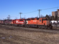 CP5932, SOO6055, and CEFX121 lead an eastbound 138 through Streetsville Ontario on clear March day. 