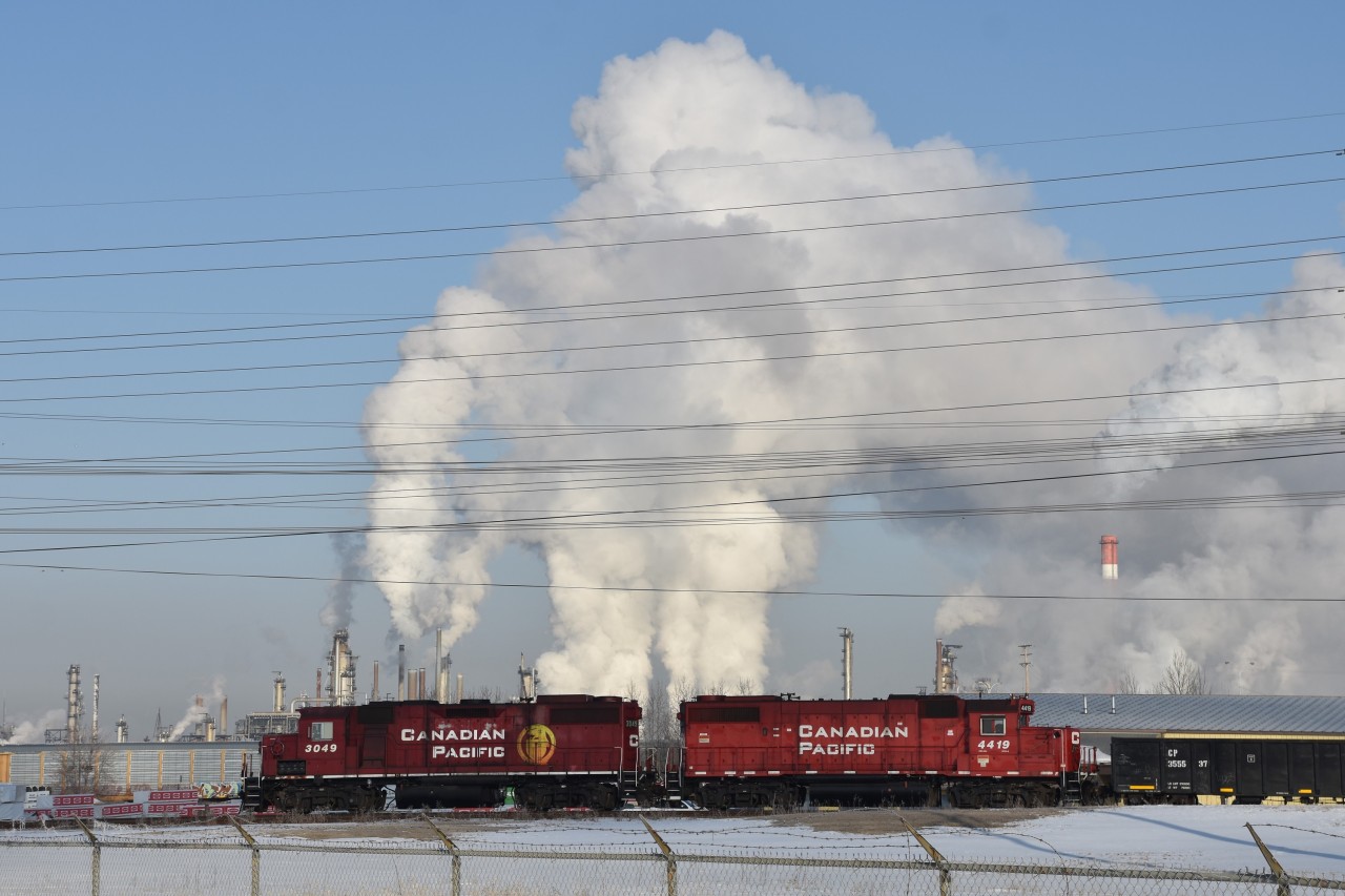 Blowing off steam....Vapour clouds rising from Imperial Oil's Strathcona Refinery give the impression that these two units have one heck of a cooling system problem. This is what happens when CN sends you to Edmonton in March.