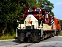 The 1400 Recrew for the North job is crossing Woolwhich Street heading North, with Mike Dacosta posing for the picture. They are going back up to the industrial sector to get some photos before they couple the power to the "RIP" train awaiting to get lifited by CN to be brought to London.